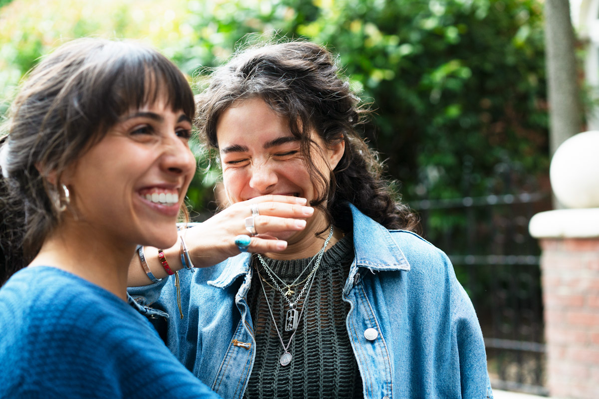 Two friends laughing together